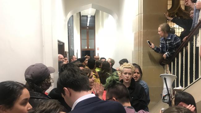 Protesters at Sydney University blocking the entrance to a talk by Bettina Arndt.