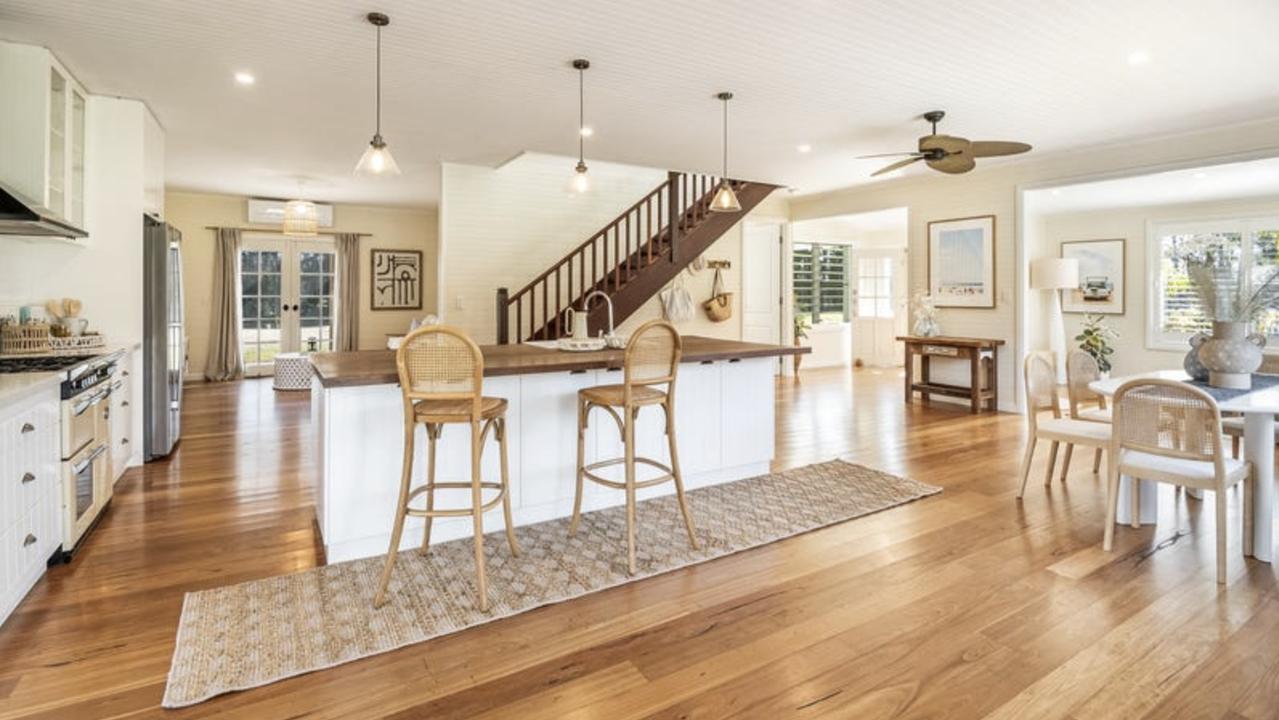 The two-storey country-style house has high ceilings, hardwood floors, VJ panelling and French doors. Picture: realestate.com.au