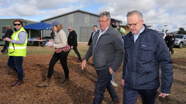 Prime Minister Anthony Albanese (right) visits Eugowra alongside Cabonne Mayor Kevin Beatty (second from right) after it was ravaged by floods in November. Picture: NCA NewsWire / Steve Gosch