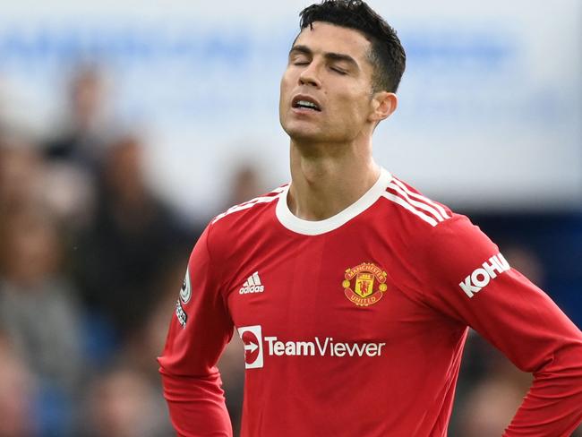 Manchester United's Portuguese striker Cristiano Ronaldo reacts during the English Premier League football match between Brighton and Hove Albion and Manchester United at the American Express Community Stadium in Brighton, southern England on May 7, 2022. (Photo by Glyn KIRK / AFP) / RESTRICTED TO EDITORIAL USE. No use with unauthorized audio, video, data, fixture lists, club/league logos or 'live' services. Online in-match use limited to 120 images. An additional 40 images may be used in extra time. No video emulation. Social media in-match use limited to 120 images. An additional 40 images may be used in extra time. No use in betting publications, games or single club/league/player publications. /