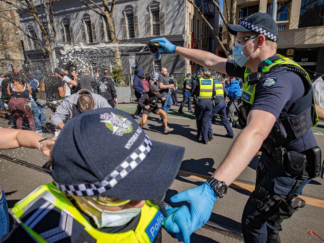 Police clash with anti-lockdown protesters in Melbourne CBD in August 2021. Picture: Jason Edwards