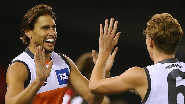 Former Giant Ryan Griffen high-fives GWS teammate Lachie Whitfield. Griffen will play country footy for Goolwa/Port Elliot this Saturday. Picture: Wayne Ludbey