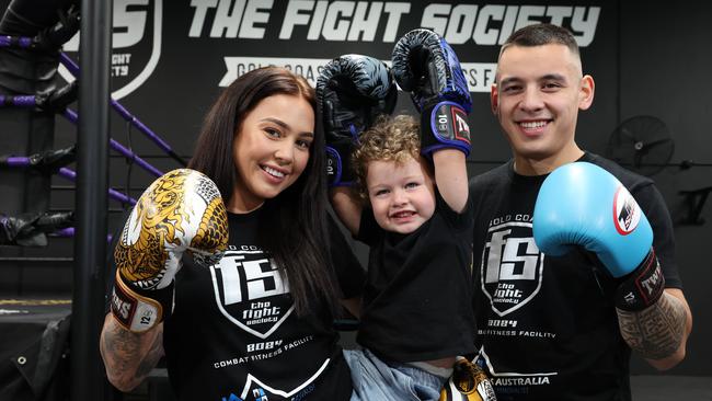 The Fight society opens this weekend at Nerang. Tegan Daly and her son Bentley 2 are the first to tour the new club with partner and owner Brandon Baresic. Picture Glenn Hampson