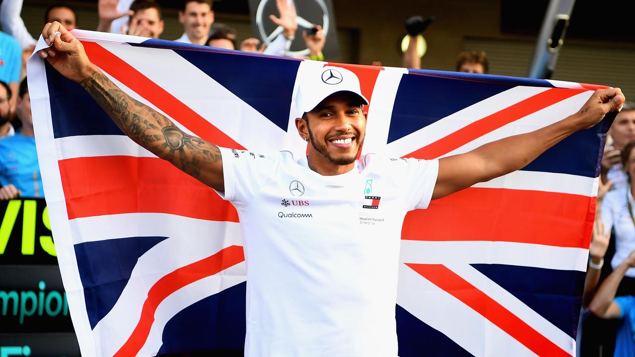 Lewis Hamilton celebrates with his team after sealing the 2018 title. Picture: Clive Mason
