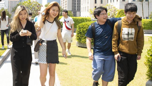 Sulli Qiam, 18, left, a University of Sydney student, has been in Bangkok for eight days of a two-week quarantine period before she can fly back to Australia. Picture: Jonathan Taylor