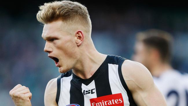 MELBOURNE, AUSTRALIA - JULY 30:  Adam Treloar of the Magpies celebrates a goal during the round 19 AFL match between the Collingwood Magpies and the Adelaide Crows at Melbourne Cricket Ground on July 30, 2017 in Melbourne, Australia.  (Photo by Michael Dodge/Getty Images)