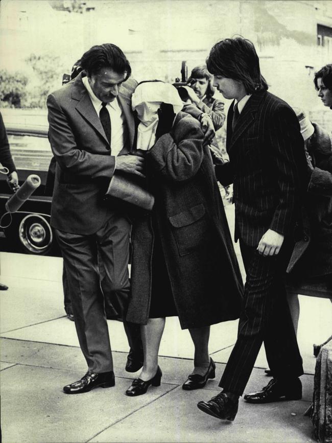 Clare Regan, her face covered, at the funeral of her murdered gangster son in 1974. Picture: Victor Colin Sumner/Fairfax Media
