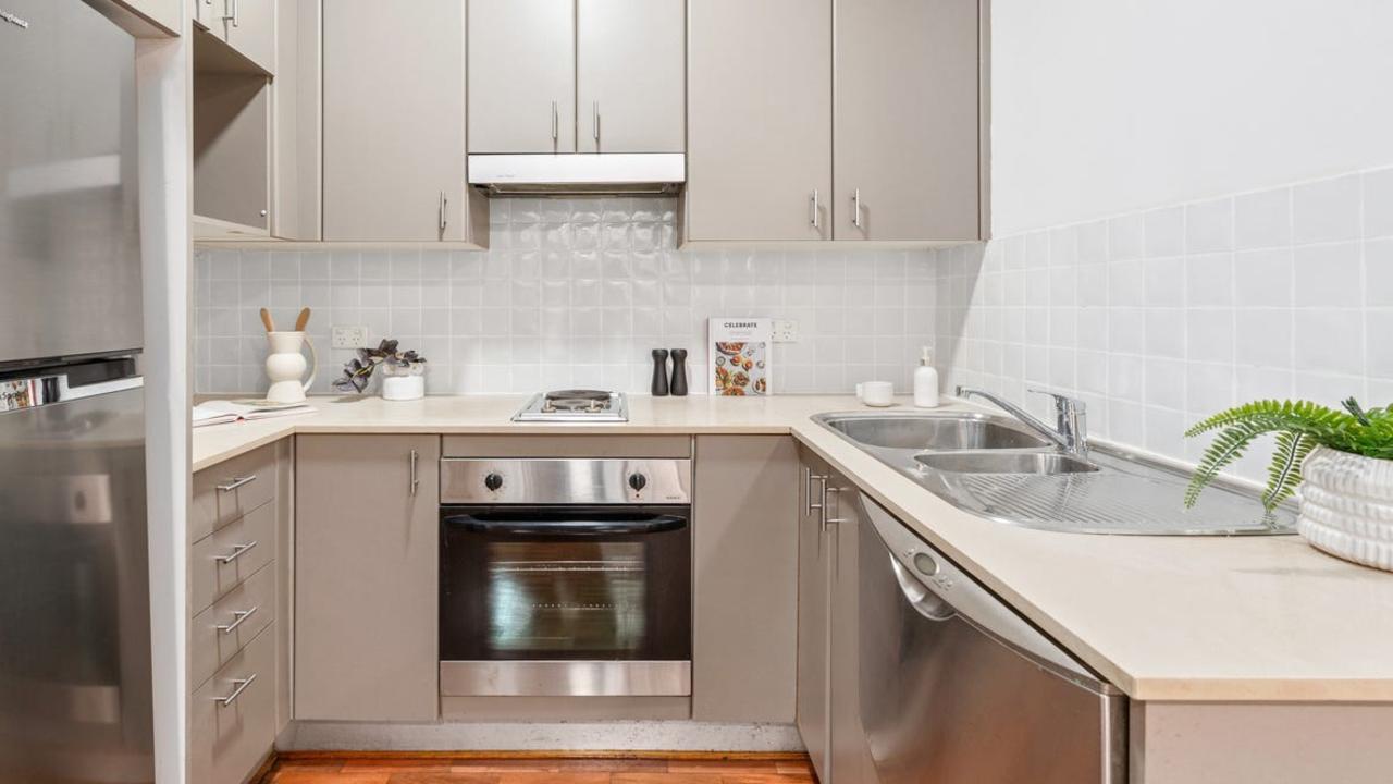 The kitchen features stainless steel appliances.