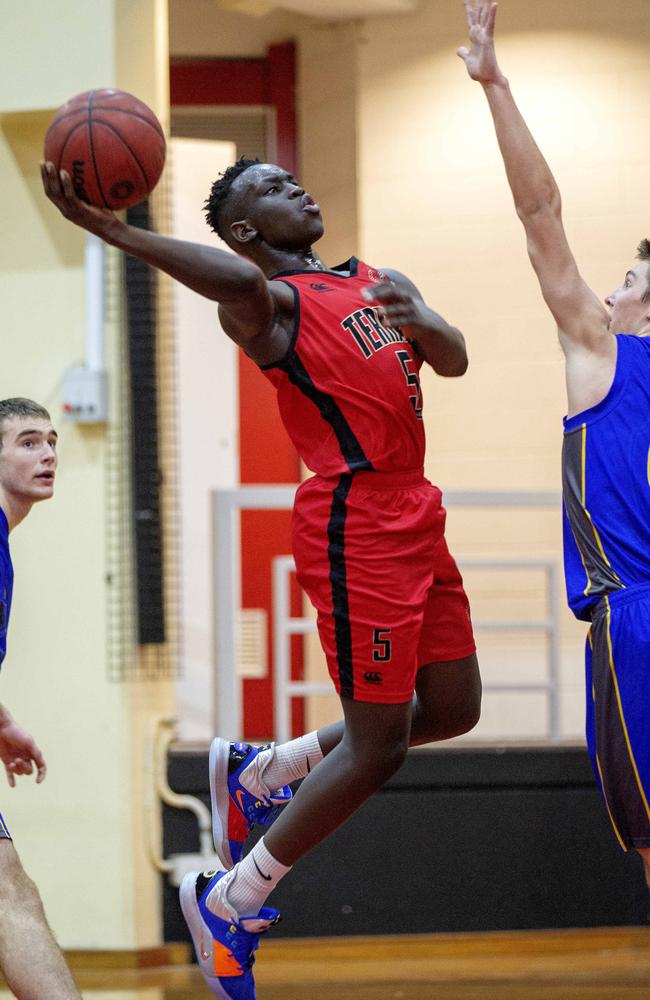 Terrace guard Nazar Angallo tries to finish a basket. Picture: Sarah Marshall