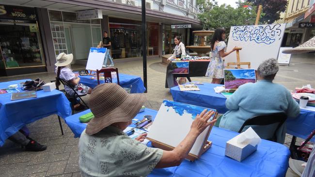 Marilyn Fraterman experimenting with the art of finger painting. Picture: Alison Foletta