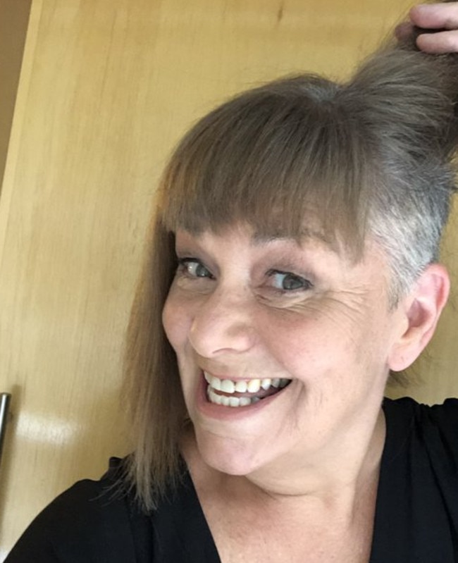 Surprise! Grey hair and a close-cropped undercut.