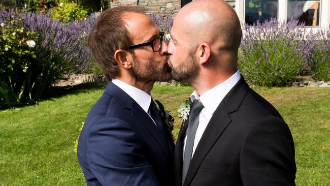 Andy John (right) kisses his Married at First Sight husband Craig after their wedding, but now says it was all nonsense. Picture: Supplied.