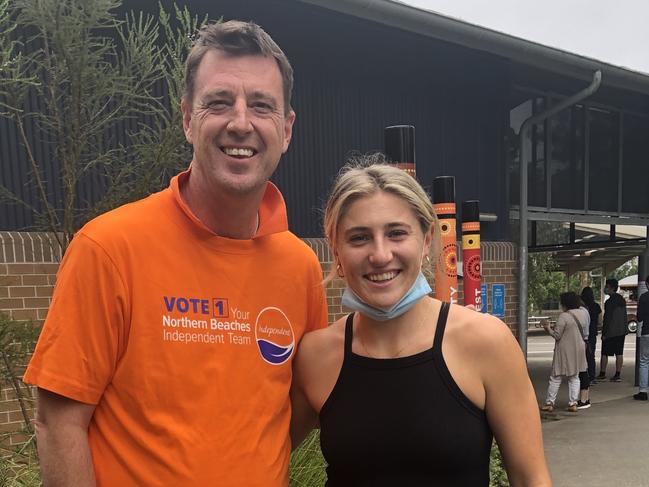 Northern Beaches mayor Michael Regan says hello to Australian Matildas and Sydney FC A- League Women football superstar Remy Siemsen, from Frenchs Forest, when she went to vote at Saturday's council election at Wakehurst Public School. Picture: Jim O'Rourke