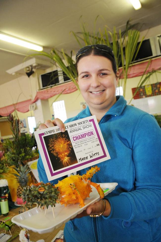 Robyn Wyllie holding Marie Witts' Best Dressed, Painted or Decorated or Novelty Use of Fruit or Veg winning entry. Picture: Renee Pilcher
