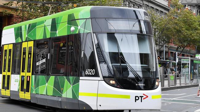 An E Class tram turns into Spencer Street in Melbourne's CBD. Picture: Jake Nowakowski