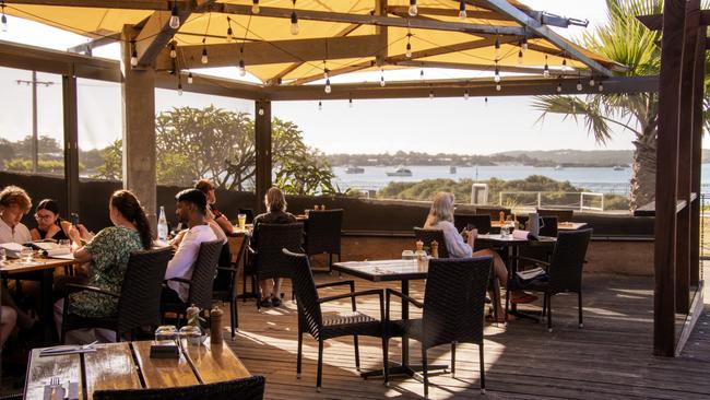 Dining on the deck, looking out to the water, at 1802 in Coffin Bay.