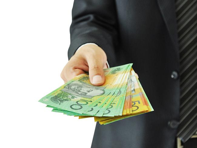 Businessman handing over, giving money  - Australian dollars