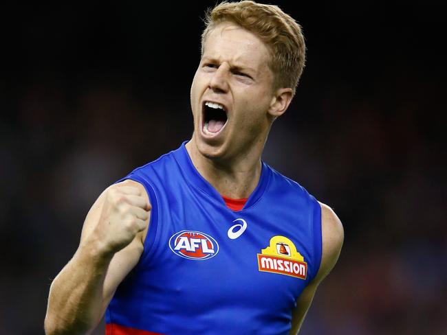 MELBOURNE, AUSTRALIA - APRIL 08:  Lachie Hunter of the Bulldogs celebrates a goal during the round three AFL match between the Western Bulldogs and the Essendon Bombers at Etihad Stadium on April 8, 2018 in Melbourne, Australia.  (Photo by Darrian Traynor/Getty Images)