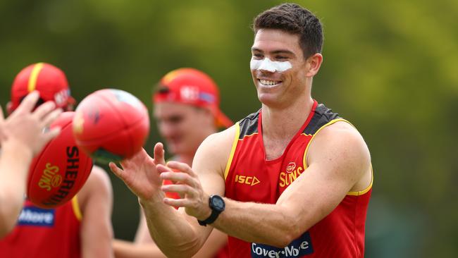 Sam Collins handballs during a Gold Coast Suns AFL media and training session at Metricon Stadium on November 04, 2019 in Gold Coast, Australia. (Photo by Chris Hyde/Getty Images)