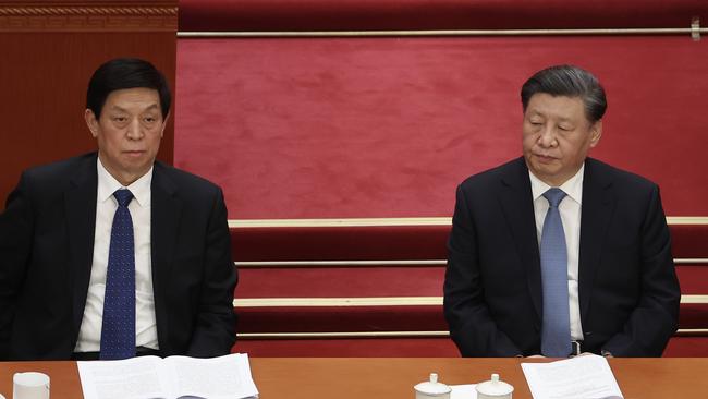 Li Zhanshu, left, of National People's Congress and President Xi Jinping attend the opening of the first session of the Chinese People's Political Consultative Conference. Picture: Getty