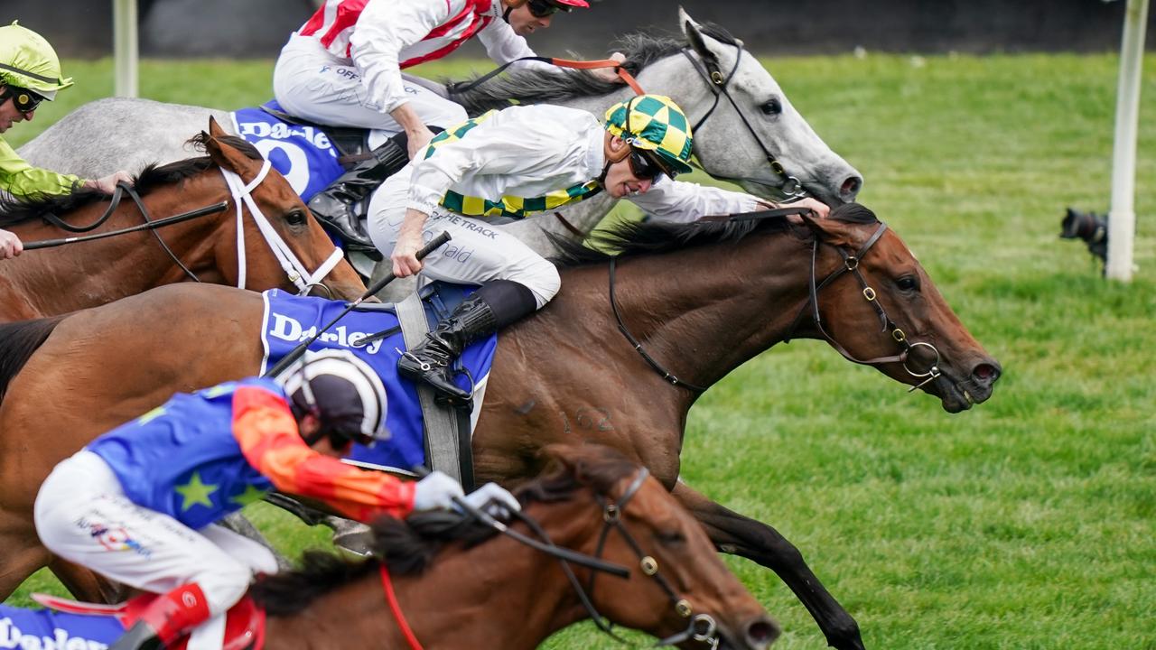 Sunshine In Paris and James McDonald (white, green and gold silks) weaved through the field to defeat Right To Party and Bella Nipotina in the Champions Sprint at Flemington. Picture: Scott Barbour/Racing Photos via Getty Images