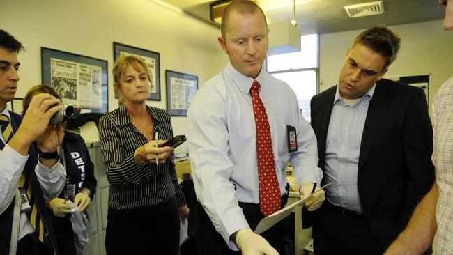 Police from the WA Fraud Squad raid The Sunday Times newspaper building in Perth, with a search warrant later found to be unjustified. Picture: News Corp Australia