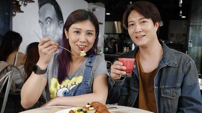 Mira Wong shares her the scrambled egg and scallop croissant with Ricky Phu at Chimichuri. Picture: Chris Pavlich