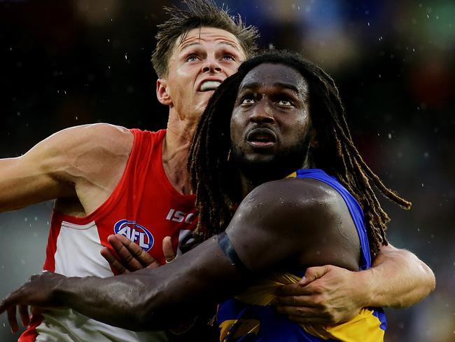 PERTH, WESTERN AUSTRALIA - MARCH 25: Callum Sinclair of the Swans contests a ruck with Nic Naitanui of the Eagles during the round one AFL match between the West Coast Eagles and the Sydney Swans at Optus Stadium on March 25, 2018 in Perth, Australia.  (Photo by Will Russell/AFL Media/Getty Images)