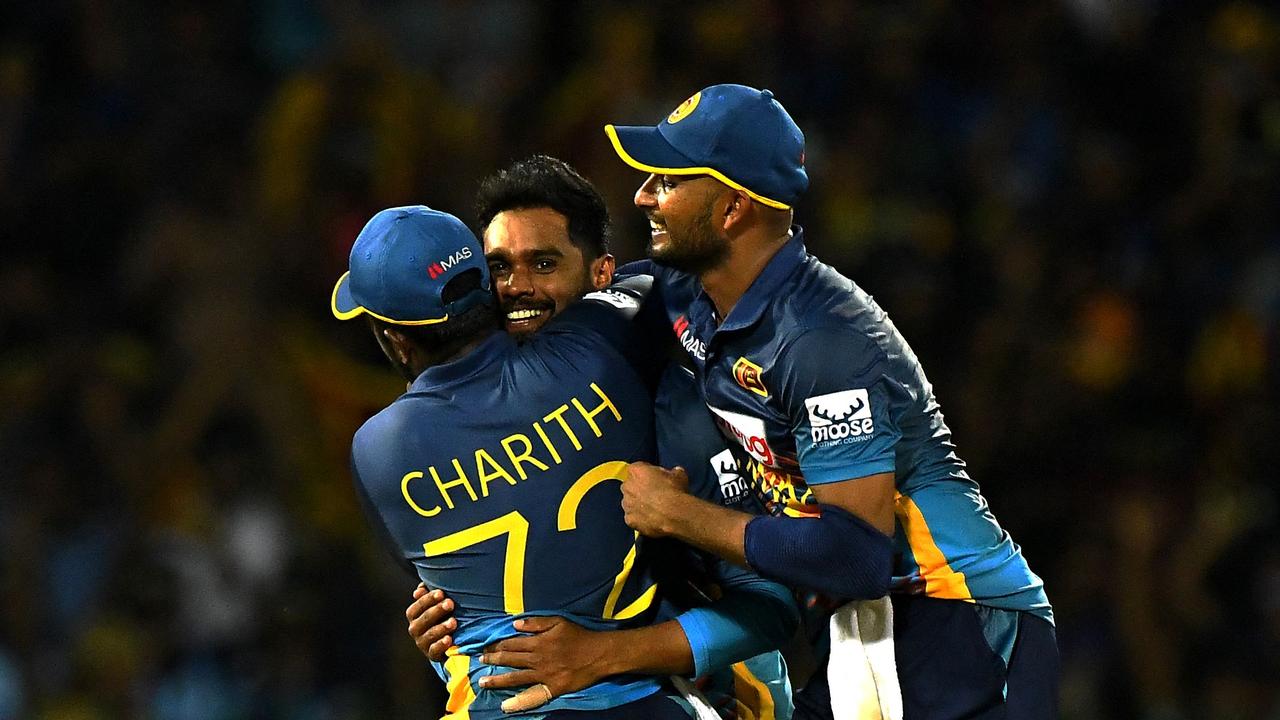 Sri Lanka's wicketkeeper Niroshan Dickwella celebrates with teammates during the fourth ODI.