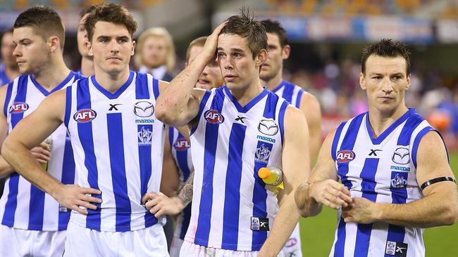 North Melbourne players dejected after the loss to Brisbane Lions.