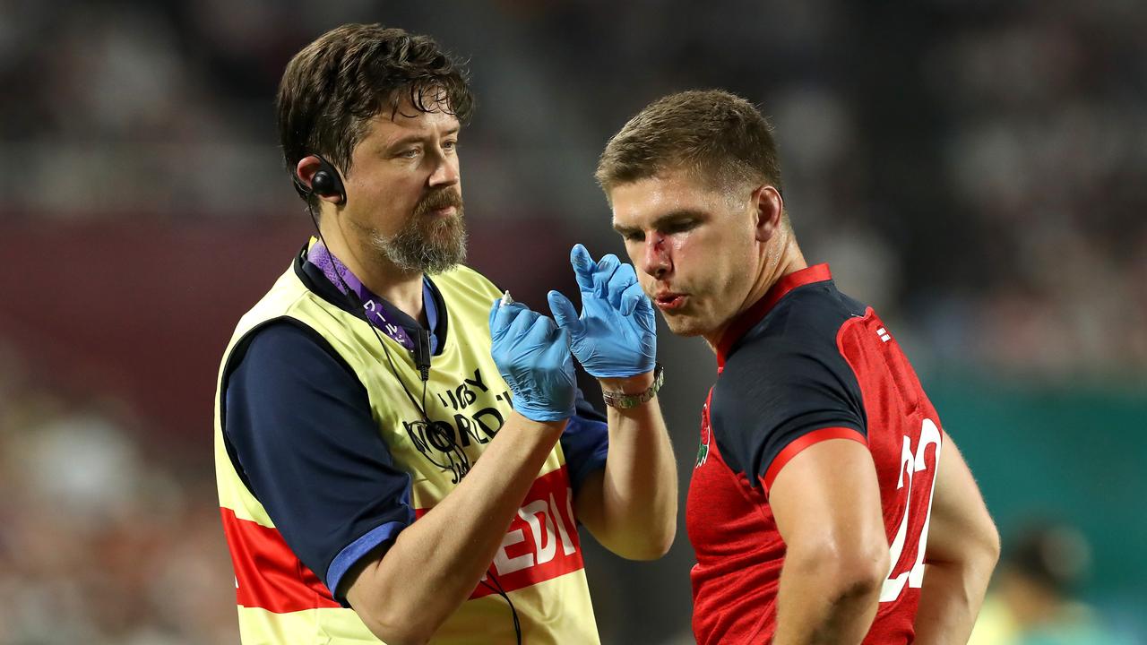 Owen Farrell of England receives medical treatment during the Rugby World Cup.