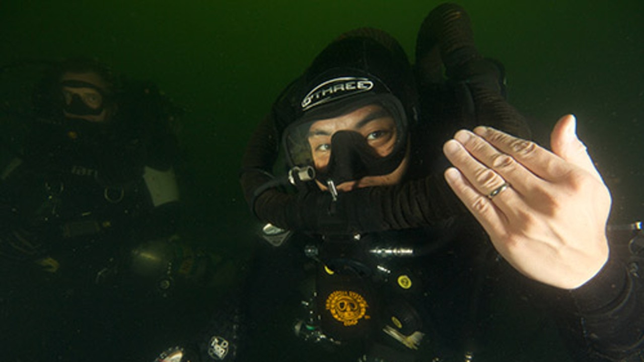 Hiro Yoshida and Sandra Smith broke records getting married 130m underwater. Picture: Guinness World Records