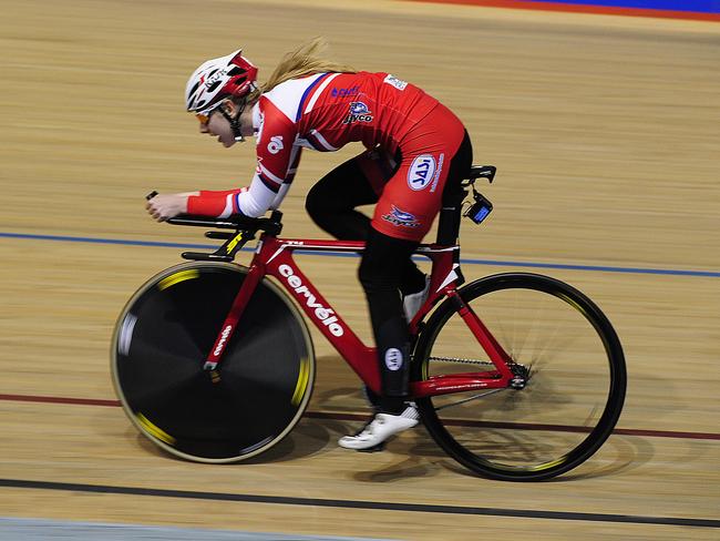 Chloe Moran, who was discovered by the South Australian Sports Institute talent ID program, hits the line paced by Brett Aitkin on the motorbike while training for the world junior track championships in Kazakhstan. Photo: Mark Brake.