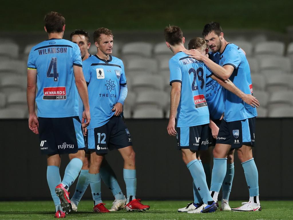 James Donachie (right) celebrates with his Sydney FC teammates after scoring in his side’s FFA Cup round-of-16 win over Macarthur FC. Picture: Matt King/Getty Images