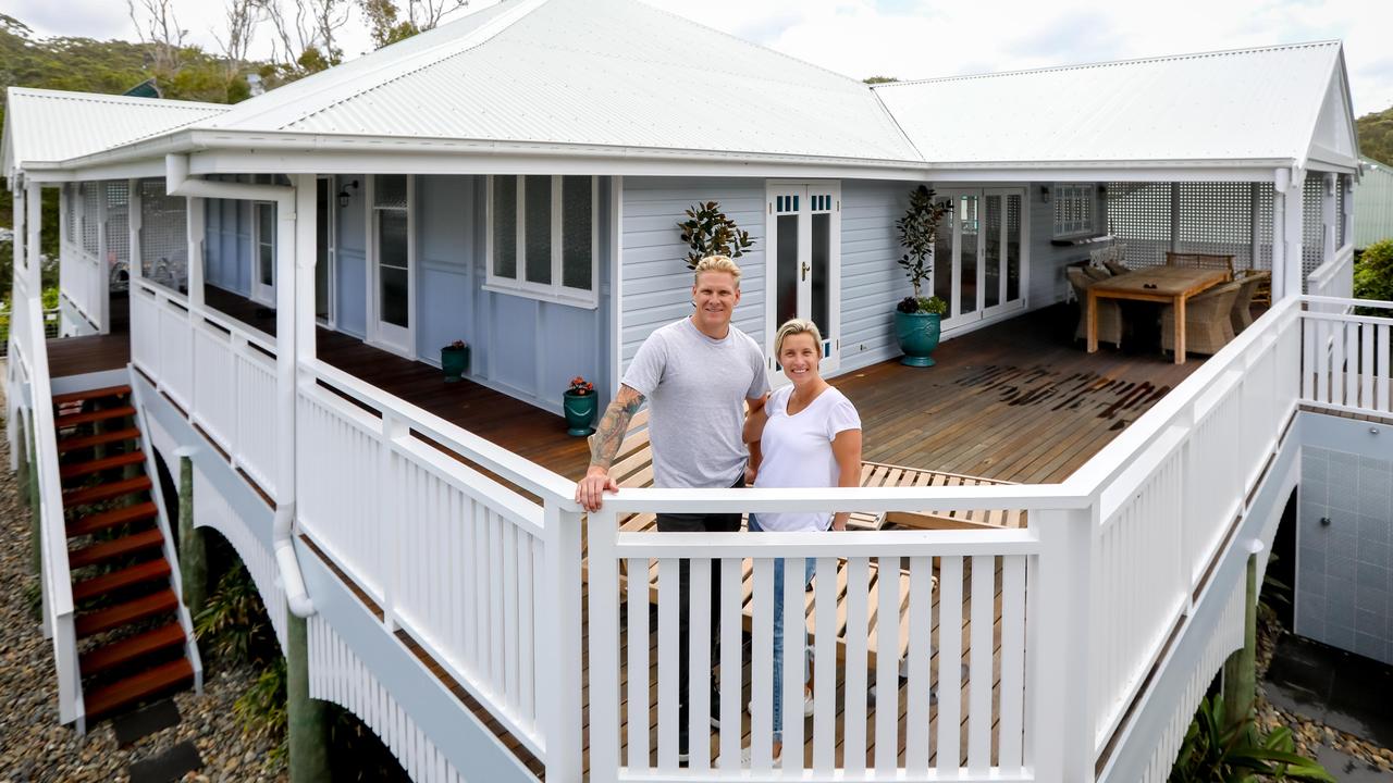 Bianca and Glen Wakelin outside their Queenslander home in Boomerang Beach NSW. The home was transported down in four pieces and reassembled in NSW. Picture: Lindsay Moller