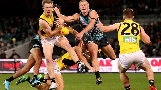 Richmond’s Jack Riewoldt marks in front of Port Adelaide’s Tom Clurey at Adelaide Oval. Picture: James Elsby/Getty