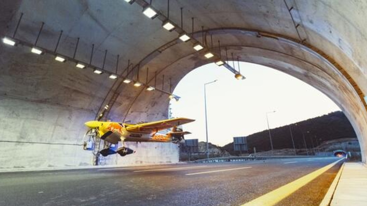 Dario Costa sets a world record by flying a plane through a road tunnel.