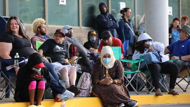 Unemployed Kentucky residents wait outside a career centre for help with their unemployment claims. Picture: AFP