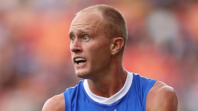 SYDNEY, AUSTRALIA - MARCH 16: Jaidyn Stephenson of the Kangaroos runs the ball during the round one AFL match between Greater Western Sydney Giants and North Melbourne Kangaroos at ENGIE Stadium on March 16, 2024 in Sydney, Australia. (Photo by Jason McCawley/AFL Photos/via Getty Images )