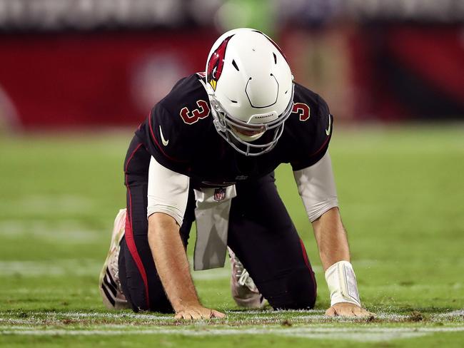 GLENDALE, AZ - OCTOBER 18: Quarterback Josh Rosen #3 of the Arizona Cardinals lies on the ground after a fourth quarter fumble against the Denver Broncos at State Farm Stadium on October 18, 2018 in Glendale, Arizona.   Christian Petersen/Getty Images/AFP == FOR NEWSPAPERS, INTERNET, TELCOS & TELEVISION USE ONLY ==