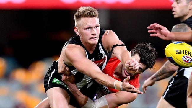 Adam Treloar has met with Western Bulldogs but could yet stay a Magpie.