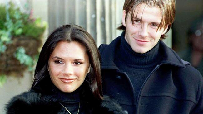 Then Victoria Adams, aka Posh Spice, beside her chuffed fiance / then Manchester United player in January 1999. Picture: AP