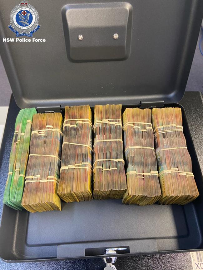 The bundles of cash seized during the raid at the King St unit. Picture: NSW Police Force.