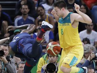 United States' Paul George (13) and Australia's Matthew Dellavedova (8) chase a loose ball during a men's basketball game at the 2016 Summer Olympics in Rio de Janeiro, Brazil, Wednesday, Aug. 10, 2016. (AP Photo/Eric Gay)