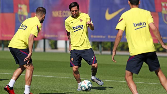 Lionel Messi of FC Barcelona controls the ball during a training session.