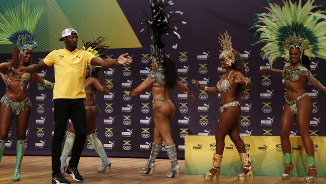 Usain Bolt dances the samba during his press conference.