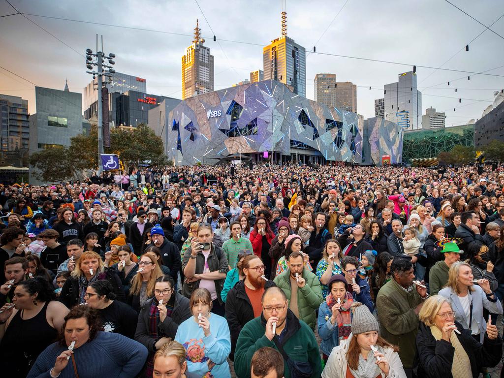 10,000 people play the Kazoo at Federation Square during RISING winter festival. Picture: Mark Stewart