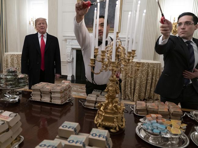 WASHINGTON, DC - JANUARY 14: U.S. President Donald Trump presents fast food to be served to the Clemson Tigers in celebration of their national championship at the White House on January 14, 2019 in Washington, DC. Clemson won their second title in three years after beating Alabama 44-16 on January 7th. (Photo by Chris Kleponis - Pool/Getty Images)