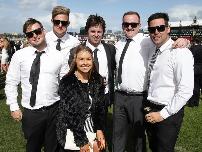 Racegoers enjoy the atmosphere on Victoria Derby Day at Flemington Racecourse. Picture: Hamish Blair