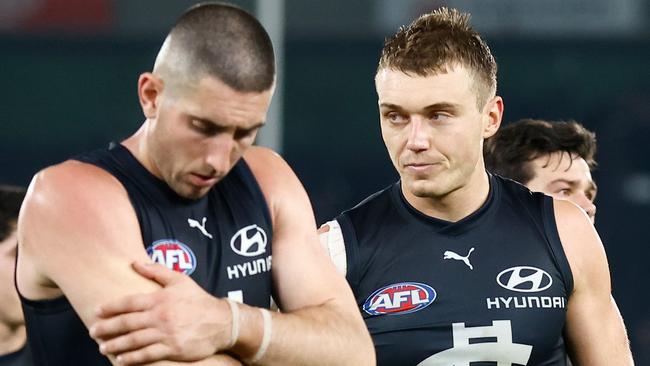 Jacob Weitering (left) and Patrick Cripps of the Blues look dejected after the loss to the Western Bulldogs. Picture: Michael Willson/AFL Photos via Getty Images